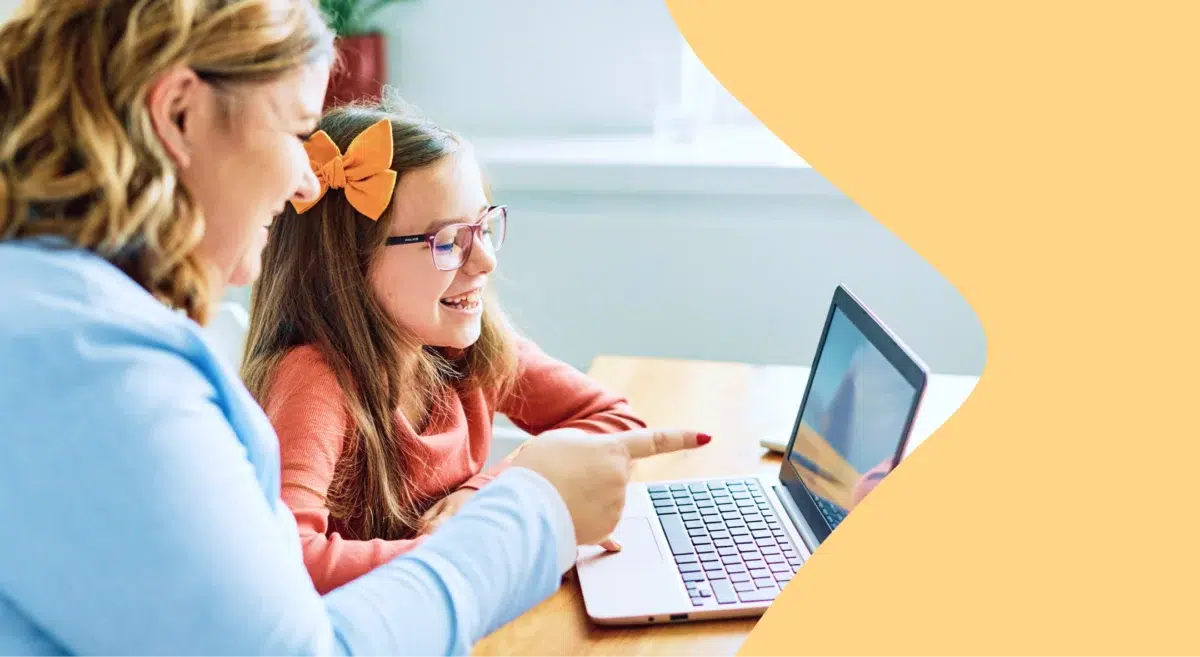 Teacher and student looking at a Teacher Appreciation Week newsletter on a laptop
